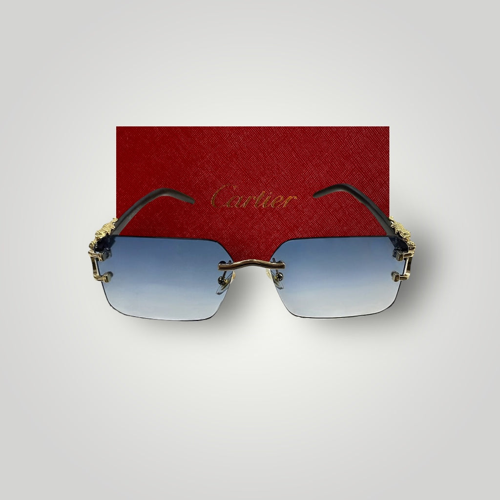 Side view of rimless Cartier sunglasses featuring black arms and detailed gold dragon design on the bridge  