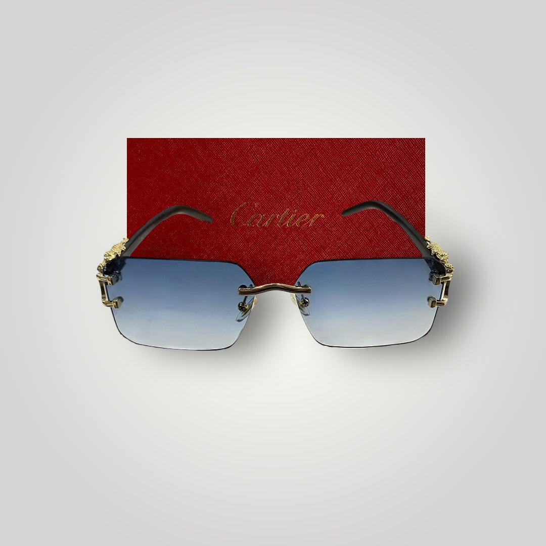 Side view of rimless Cartier sunglasses featuring black arms and detailed gold dragon design on the bridge  