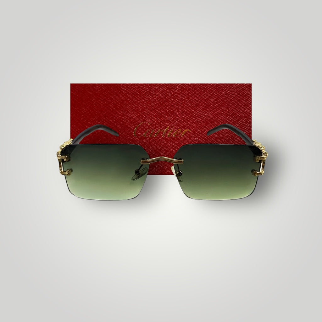 Detailed view of Cartier designer sunglasses featuring gold-tone dragon design on the bridge and green rectangular lenses  