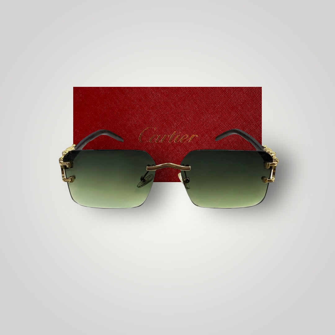 Detailed view of Cartier designer sunglasses featuring gold-tone dragon design on the bridge and green rectangular lenses  