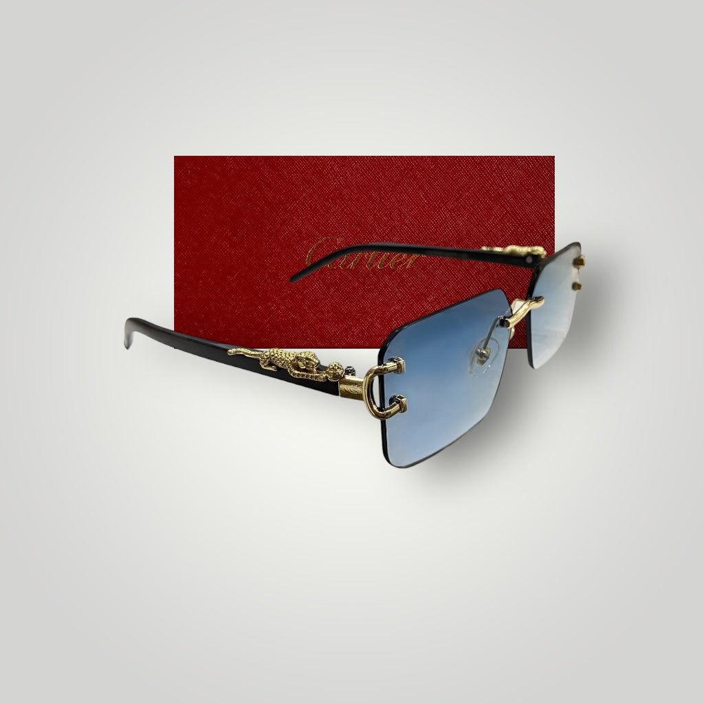 Close-up of Cartier sunglasses with sky blue rectangular lenses and gold dragon accents on temples  
