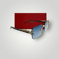 Close-up of Cartier sunglasses with sky blue rectangular lenses and gold dragon accents on temples  