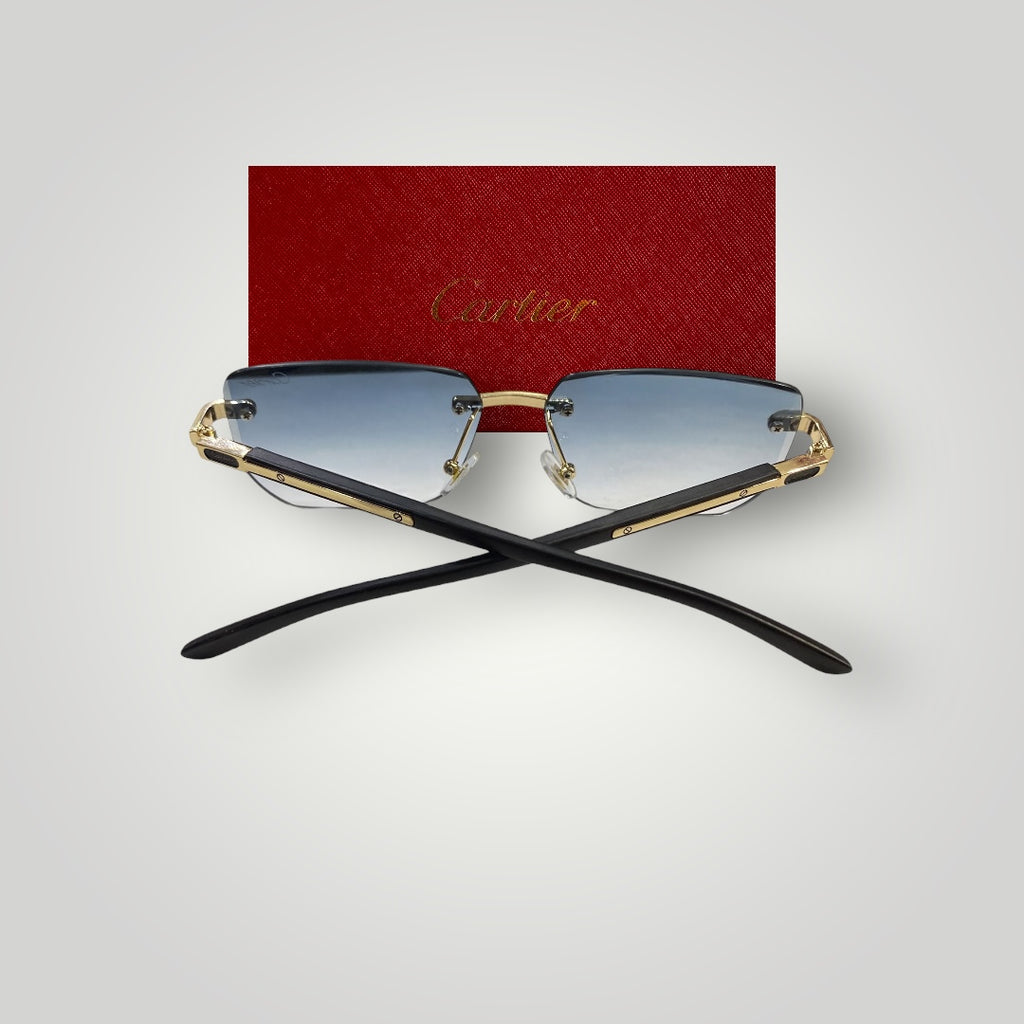 Close-up of gold-accented Cartier eyewear with transparent rimless arms and stylish lens tint
