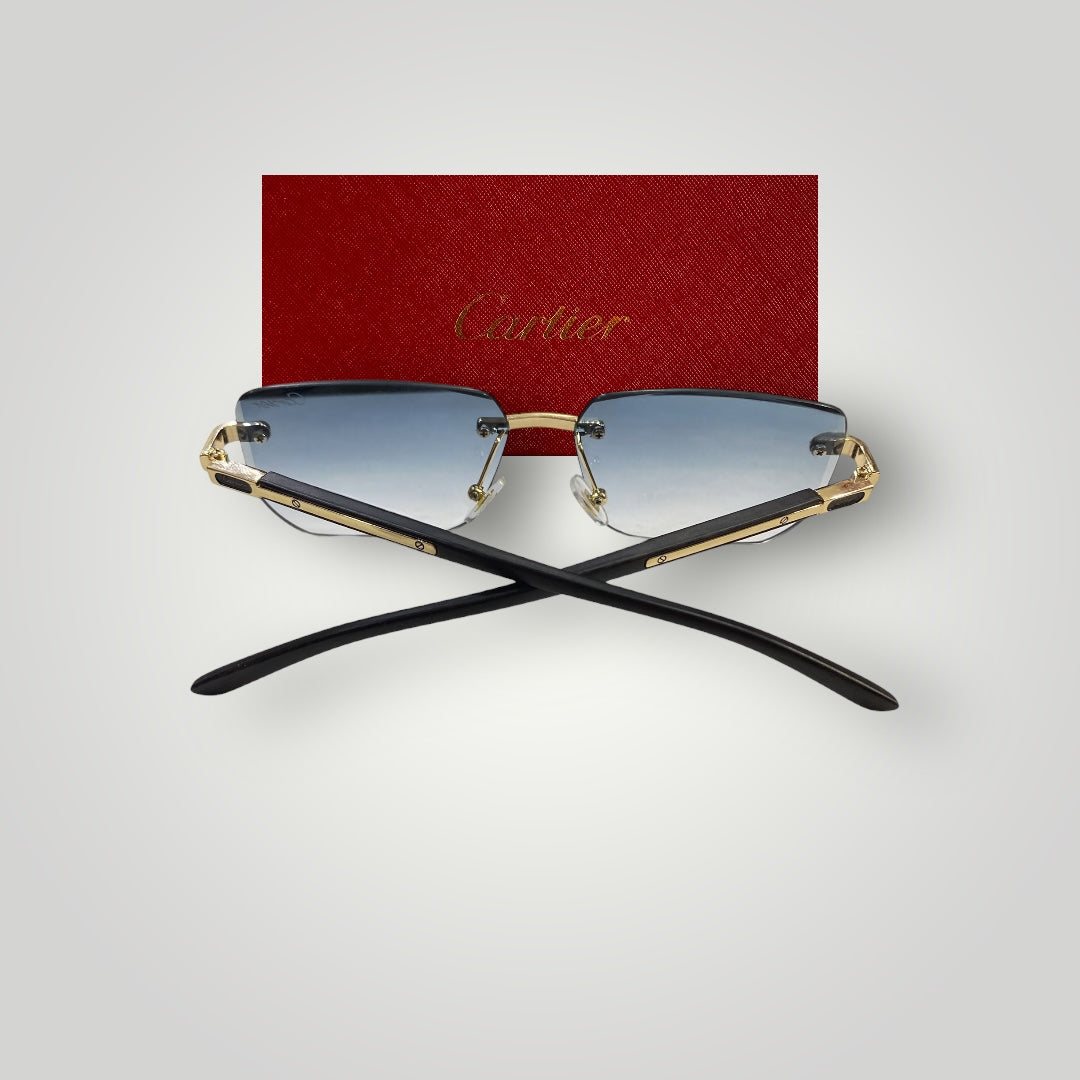 Close-up of gold-accented Cartier eyewear with transparent rimless arms and stylish lens tint