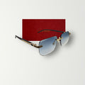 Cartier rimless sunglasses with soft gradient blue lenses and sleek gold metal frame  