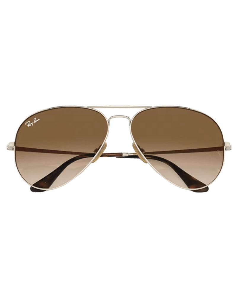 Front view of Ray-Ban aviator sunglasses displaying brown gradient lenses and silver frame with logo