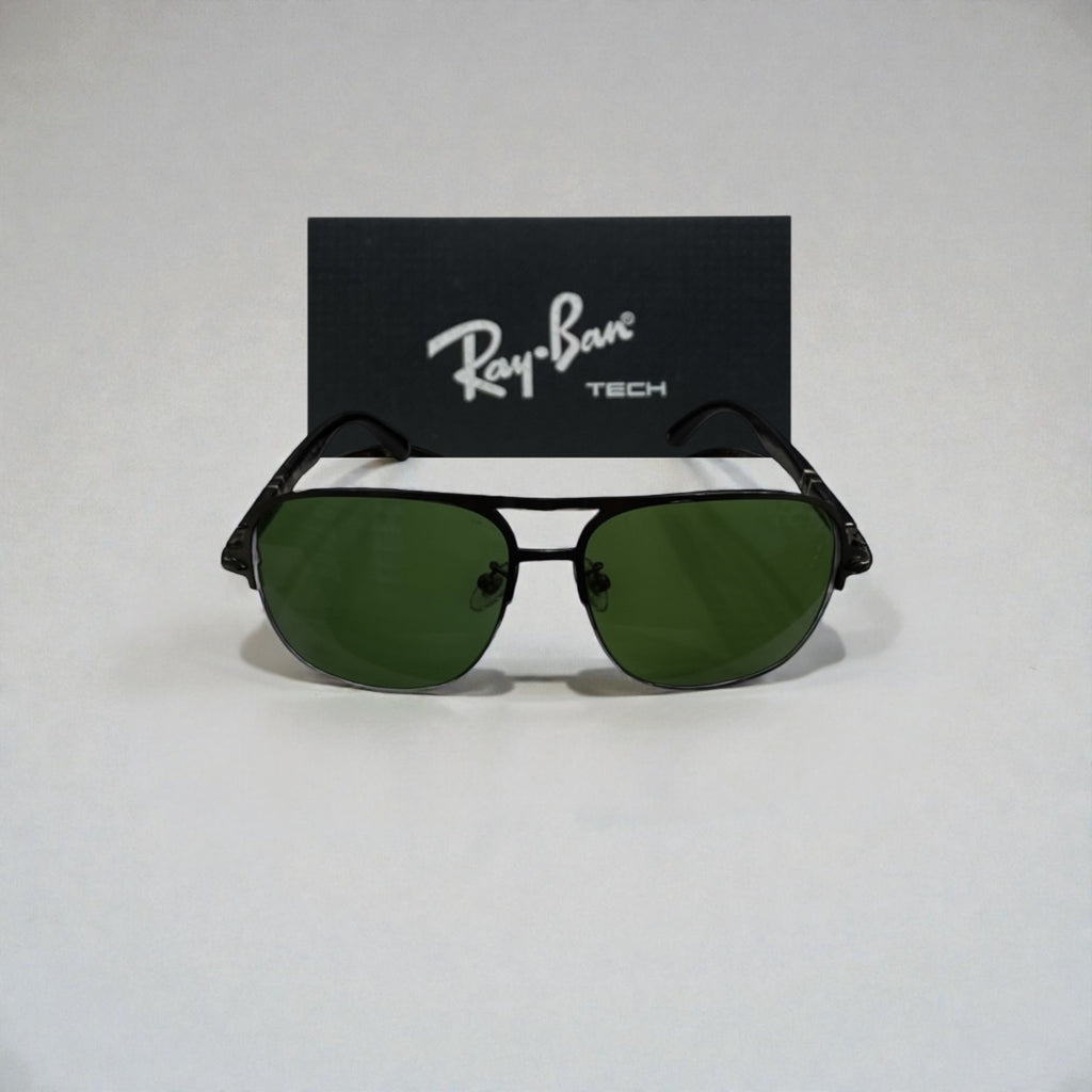 Front view of black metal Ray-Ban Tech aviator sunglasses with green lenses and Ray-Ban logo box behind