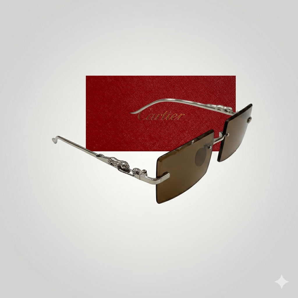 Luxury rimless sunglasses with brown lenses and silver metal temples, displayed with red Cartier case background.