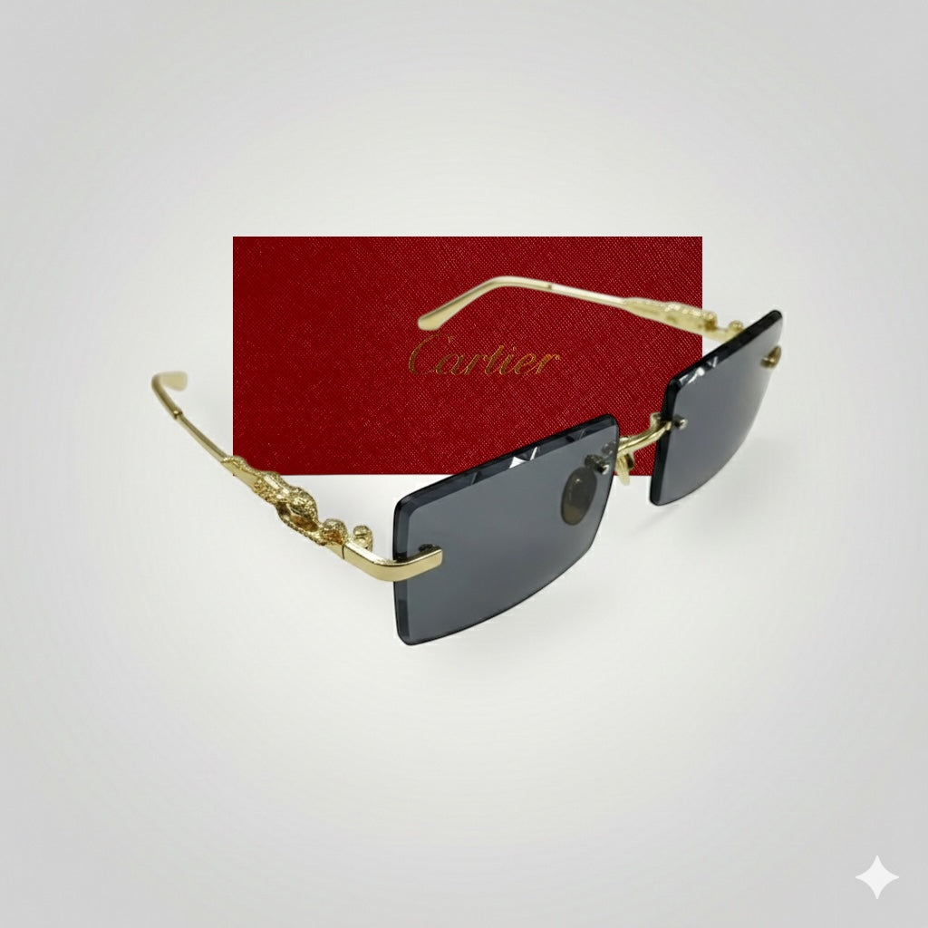 Side angle view of Cartier sunglasses with rectangular dark lenses and gold textured frames displayed in front of a red Cartier box
