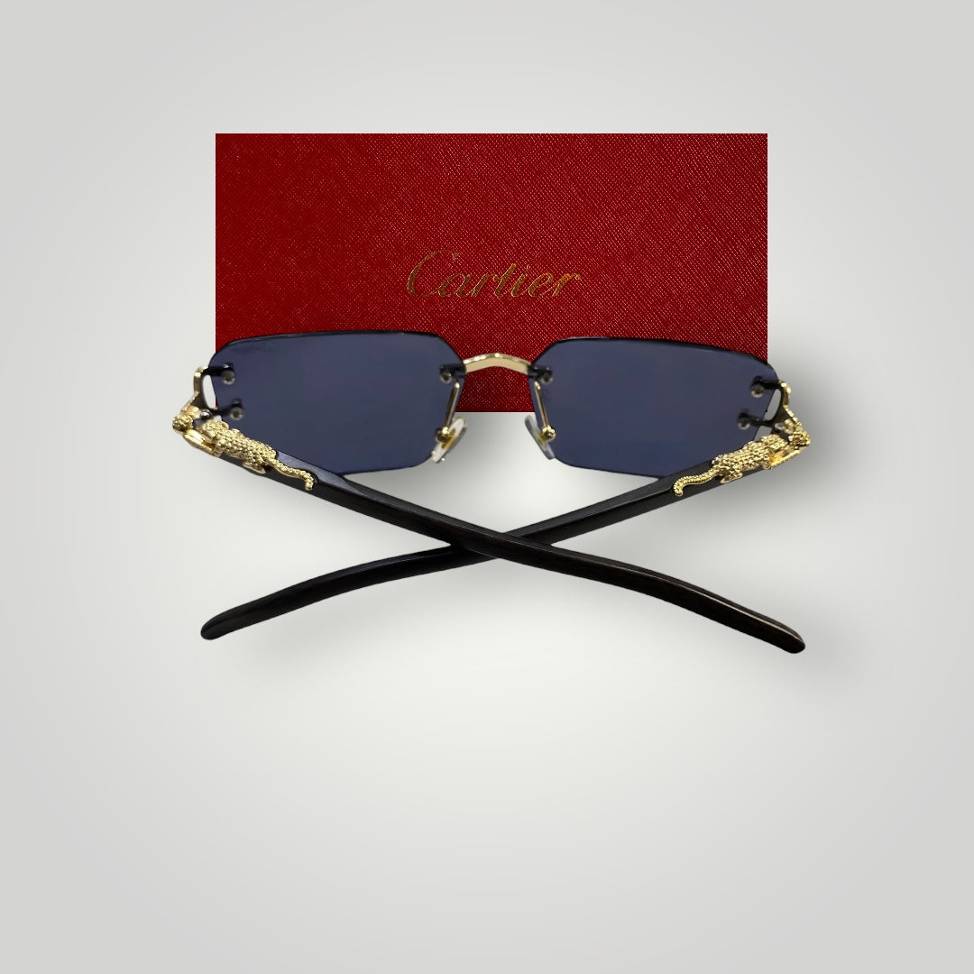 Rear view showing black temple arms crossed with gold dragon embellishments on luxury rimless sunglasses