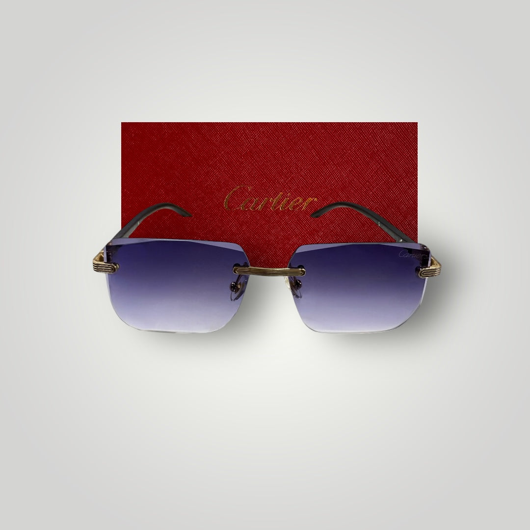 Front view of Cartier rimless sunglasses displaying gradient blue lenses and gold-tone detailing with red Cartier box background