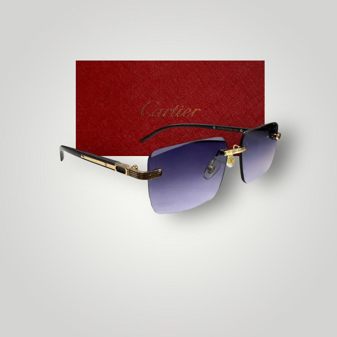 Cartier luxury rimless sunglasses with gradient blue lenses and gold-tone metal accents in front of red Cartier box