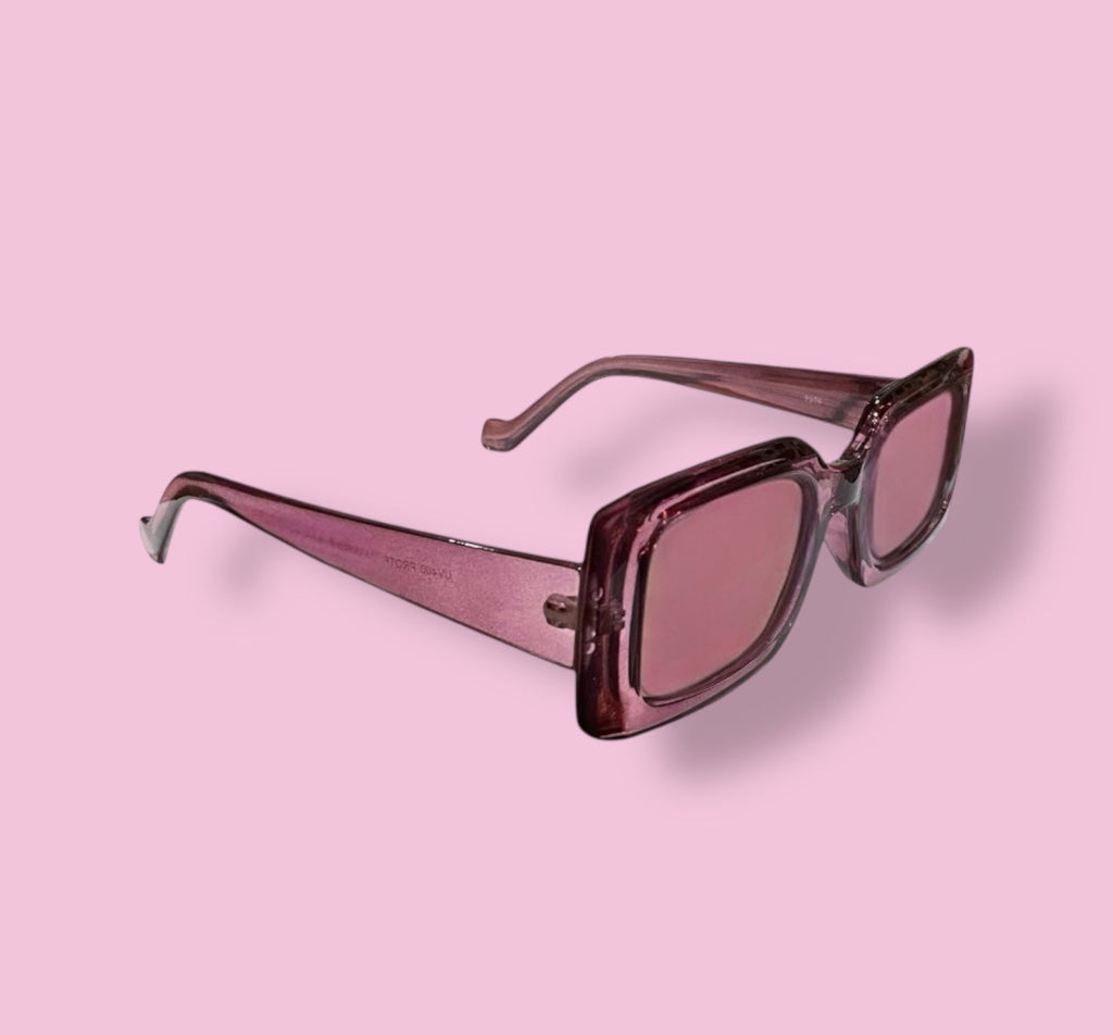 Side angle of Beenai Original 3003 women's sunglasses showcasing the pink transparent rectangular frame and matching tinted lenses