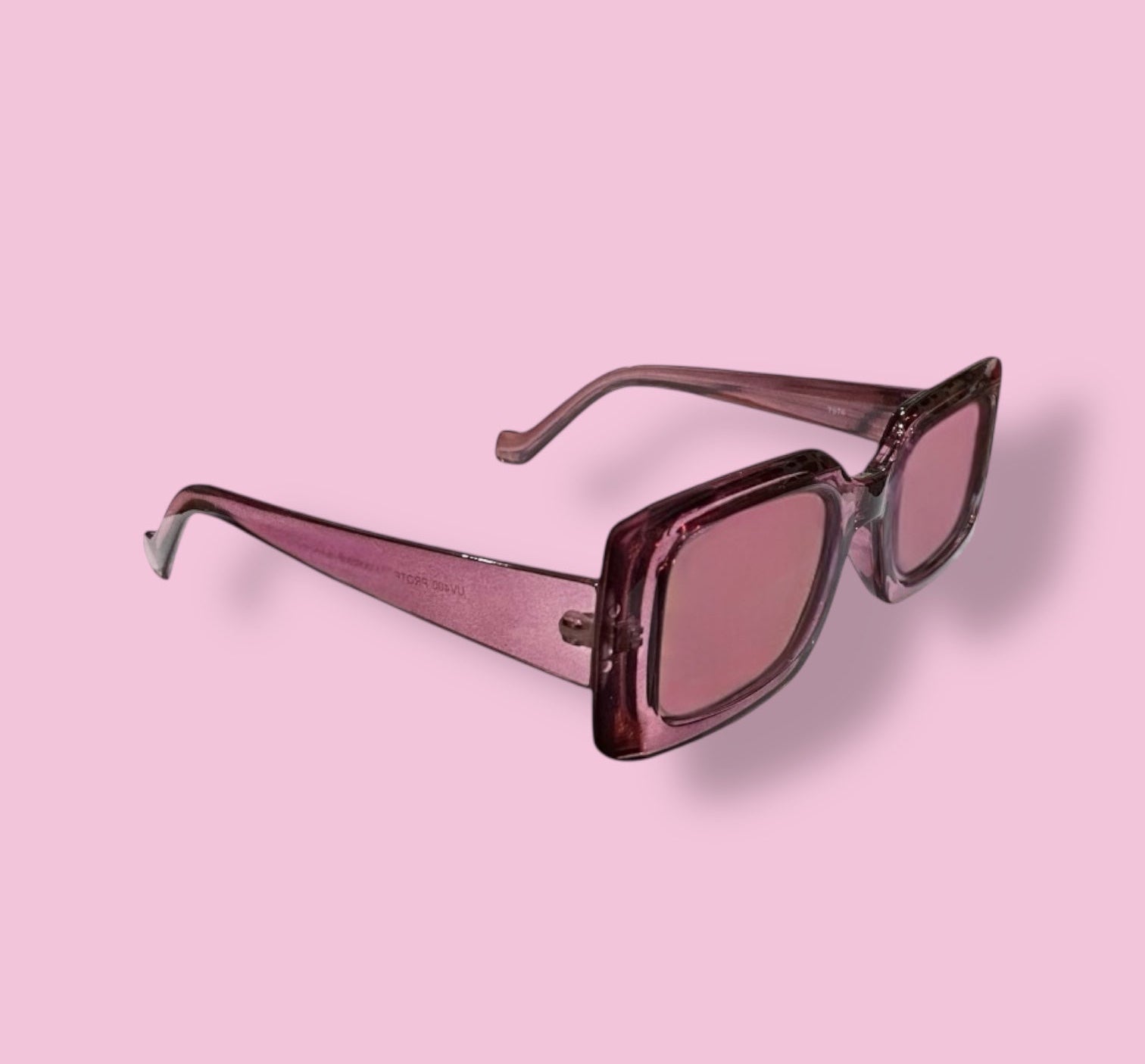 Side angle of Beenai Original 3003 women's sunglasses showcasing the pink transparent rectangular frame and matching tinted lenses