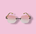 Front view of Beenai Original 3002 women sunglasses with rimless pink gradient lenses and gold arms against pink background
