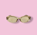 Front view of Beenai Original 3004 sunglasses with translucent light amber oval frame and matching tinted lenses on pink background